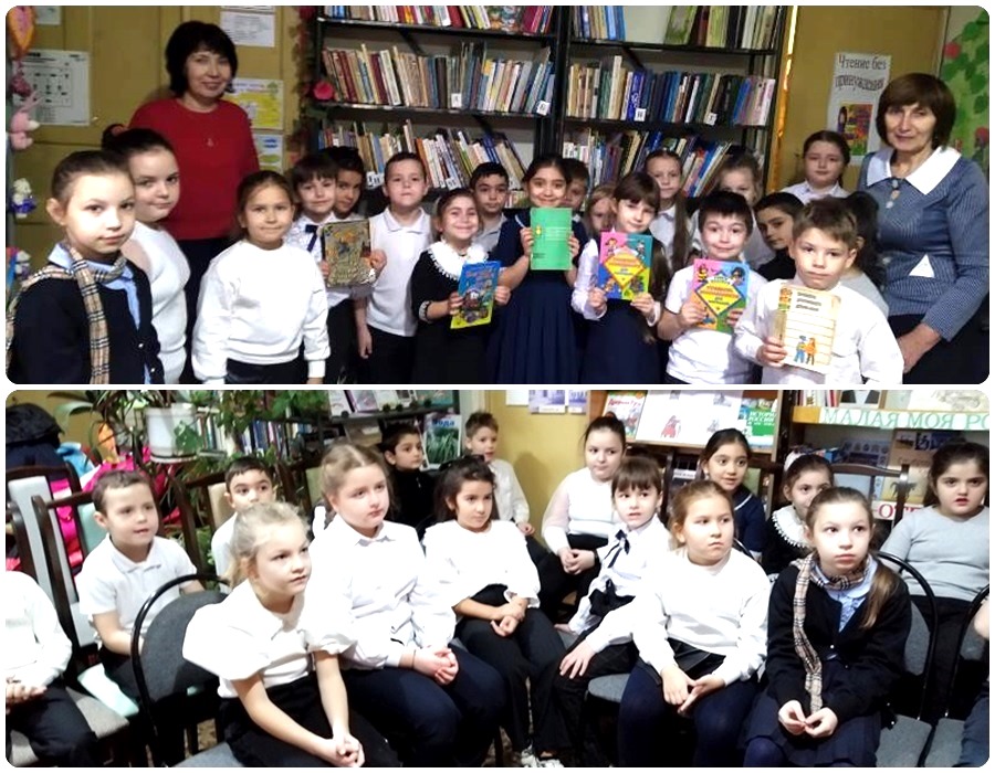 Дети фотографируются с книжками о ПДД.