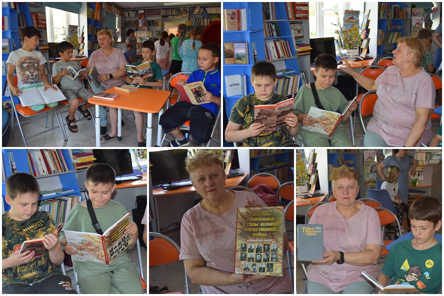 на фото: дети читают книги, посвящённые битве за Кавказ